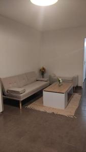 a living room with a couch and a coffee table at F4 - Duplex spacieux proche d'Orly in Athis-Mons