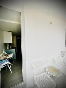 a room with a table and chairs and a kitchen at AMBER APARTMENTS - SUNNY STUDIO in Morro del Jable