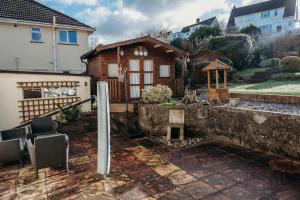 a house with a table and chairs in a yard at Ocean City Family Home in Plymouth