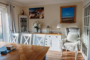 a room with a desk and a chair and a table at Ocean City Family Home in Plymouth