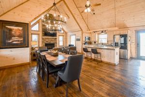 a dining room and kitchen with a table and chairs at Black Bearry in Blue Ridge