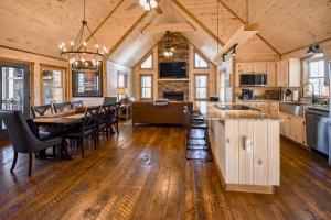 a kitchen and dining room with a table and chairs at Black Bearry in Blue Ridge