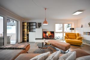 a living room with a couch and a fireplace at Haus Gohlke in Füssen