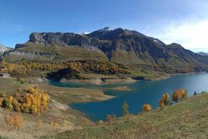 a view of a lake in the mountains at Appartement à Queige in Queige +1 photo