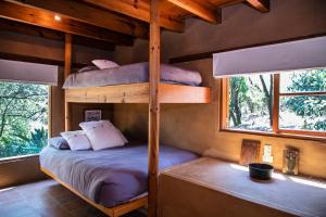 En eller flere senge i et værelse på Exclusive Ranch in Valle de Bravo with Pool + 62 billeder