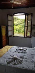 Cama ou camas em um quarto em Pousada Siroba BEIRA RIO