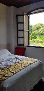 Cama ou camas em um quarto em Pousada Siroba BEIRA RIO