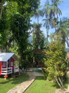 Um jardim em Pousada Siroba BEIRA RIO