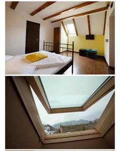 pokój z łóżkiem i oknem w obiekcie SIAN Sanctuary Villa w Braszowie