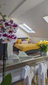 a bedroom with a bed and a mirror with flowers at Sidney Grove B&B in Newcastle upon Tyne