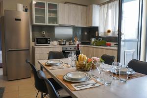 A kitchen or kitchenette at Theo and MS Luxurious Apartments