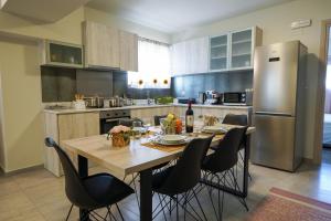 A kitchen or kitchenette at Theo and MS Luxurious Apartments