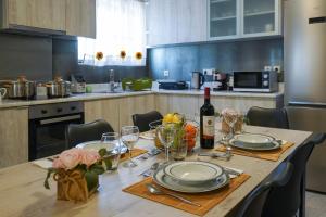 A kitchen or kitchenette at Theo and MS Luxurious Apartments