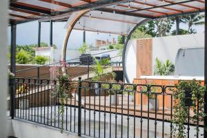 a balcony with plants and a fence at Refugio del Mar Luxury Hotel Boutique in Bucerías