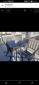 a blue table and two chairs on a deck at Birds Eye View in Mainsriddle +7 photos