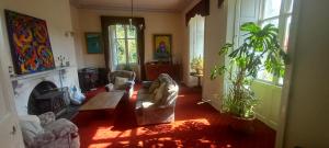 a living room with a couch and a fireplace at Cregg Castle in Galway