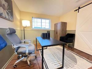 a room with a desk and two chairs and a window at A retreat nestled in the heart of NKY in Florence