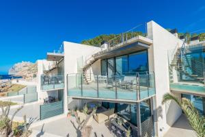 an image of a house with balconies at Mirador Blue K Cala Sant Vicenc in Cala de Sant Vicent