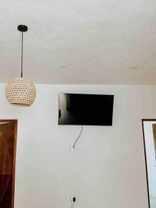 TV a/nebo společenská místnost v ubytování Casa Calec: Dpto B. con piscina/2 min. playa