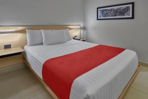 Postel nebo postele na pokoji v ubytování City Express by Marriott Cancun