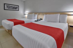 Postel nebo postele na pokoji v ubytování City Express by Marriott Cancun