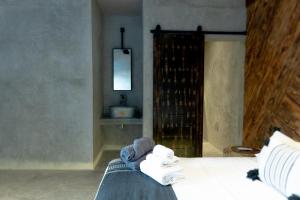 Postel nebo postele na pokoji v ubytování Hotel Macondo Estilo Holbox