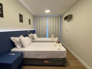 Posteľ alebo postele v izbe v ubytovaní Villa Francione Fltas em Bombas
