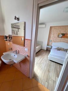 A bed or beds in a room at Bella Tropea Accommodation