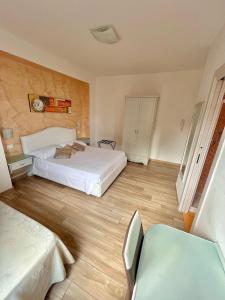 A bed or beds in a room at Bella Tropea Accommodation