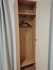 a closet with a wooden door and a hanger at Apartments in Biedenkopf in Biedenkopf