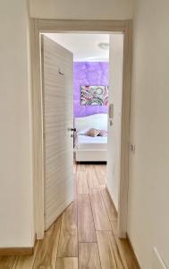 A bed or beds in a room at Bella Tropea Accommodation
