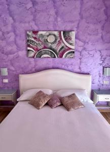 A bed or beds in a room at Bella Tropea Accommodation