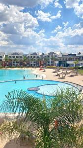 a swimming pool at a resort with people in it at Tranquil Gateways-The blyde crystal lagoon in Pretoria