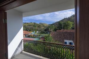 a view from the balcony of a house at Resort Fazenda 3 Pinheiros in Engenheiro Passos