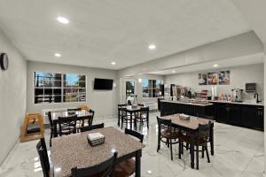 a kitchen and dining room with tables and chairs at Knights Inn - Belton/Temple in Belton