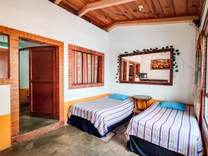 En eller flere senge i et værelse på Joyas Del Sol Hotel