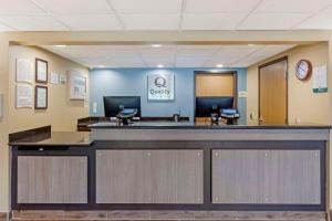 a lobby with a reception desk in a hospital at Quality Inn in Oshkosh