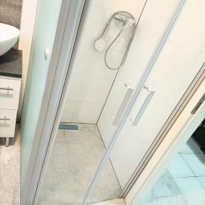 a shower with a glass door in a bathroom at FMI9Accomation Raunheim in Raunheim