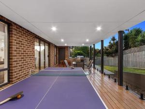a ping pong table in the middle of a house at 11a Railway Parade Wandin North in Wandin North