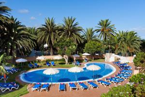 an overhead view of a pool with chairs and umbrellas at Sol Puerto de la Cruz Tenerife in Puerto de la Cruz