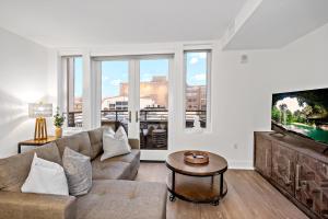 a living room with a couch and a tv at Hala DC in Washington, D.C.