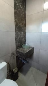 Ein Badezimmer in der Unterkunft Área de Lazer e Hospedagem completa