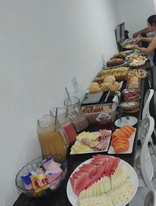 a long table with many different types of food at Pousada LuMar Maragogi in Maragogi