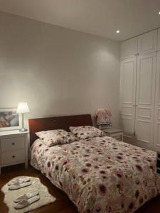 a bedroom with a bed and a dresser and a bed sidx sidx sidx sidx at Eiffel Edge Escape in Paris