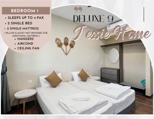Un dormitorio con dos camas y un cartel que dice "creer en el hogar" en Roxy Sematan Beach Townhouse Deluxe 7 ,8 ,9, en Sematan