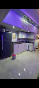 a kitchen with purple lighting and a counter top at Sea View Studio alexandria in Alexandria