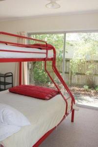 a bunk bed in a room with a window at 44 Scarborough Tce in Hanmer Springs