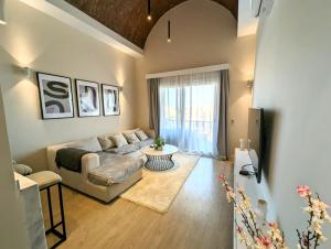a living room with a couch and a table at Luxury in the heart of Gouna in Hurghada