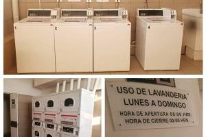 聖地亞哥的住宿－Providencia a pasos del metro Pedro de Valdivia，两幅画,两台洗衣机在房间