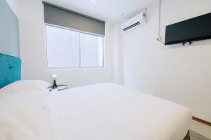 TV a/nebo společenská místnost v ubytování The Concept Hotel Melaka City